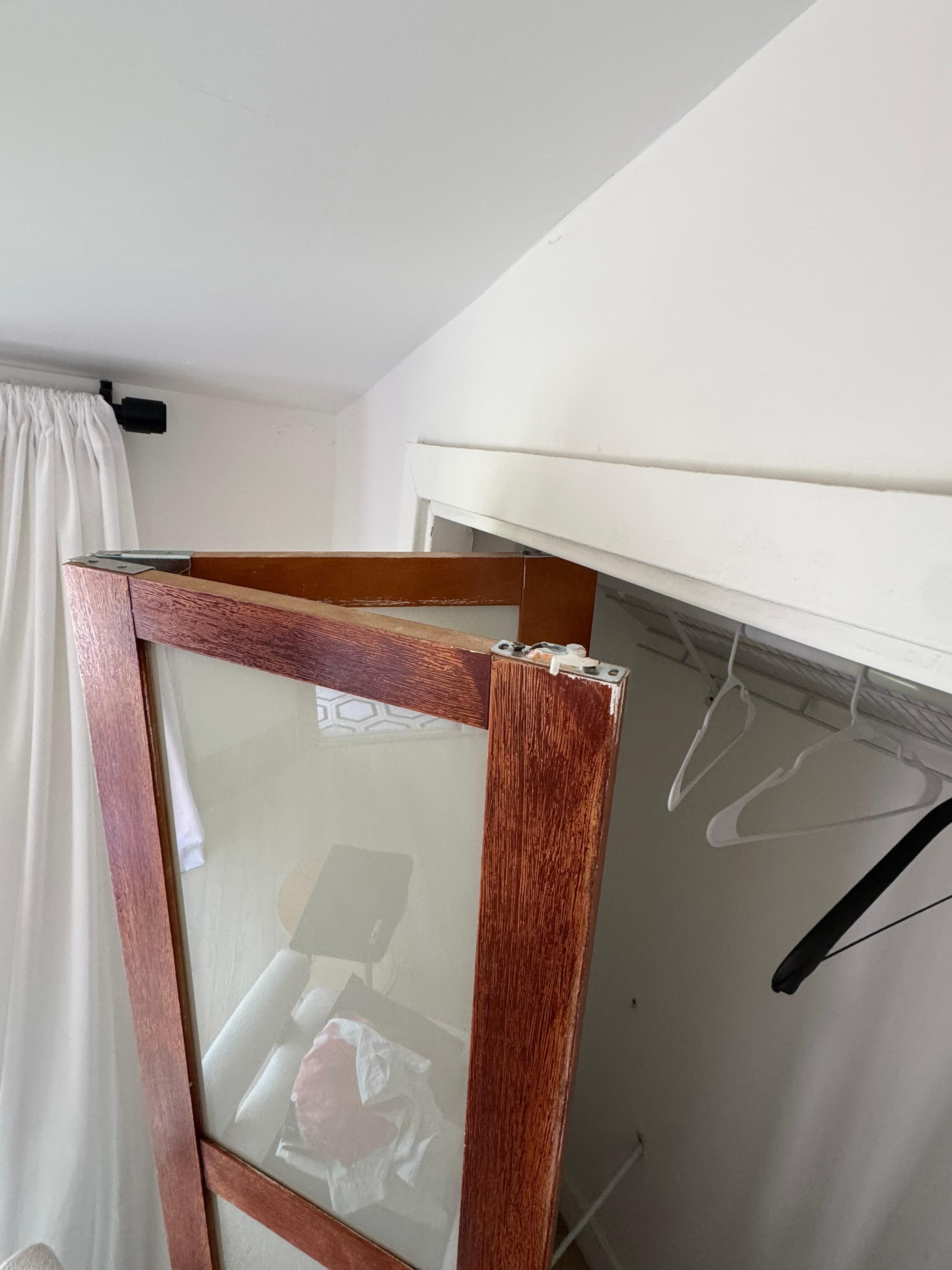 Broken closet door that almost fell off my head