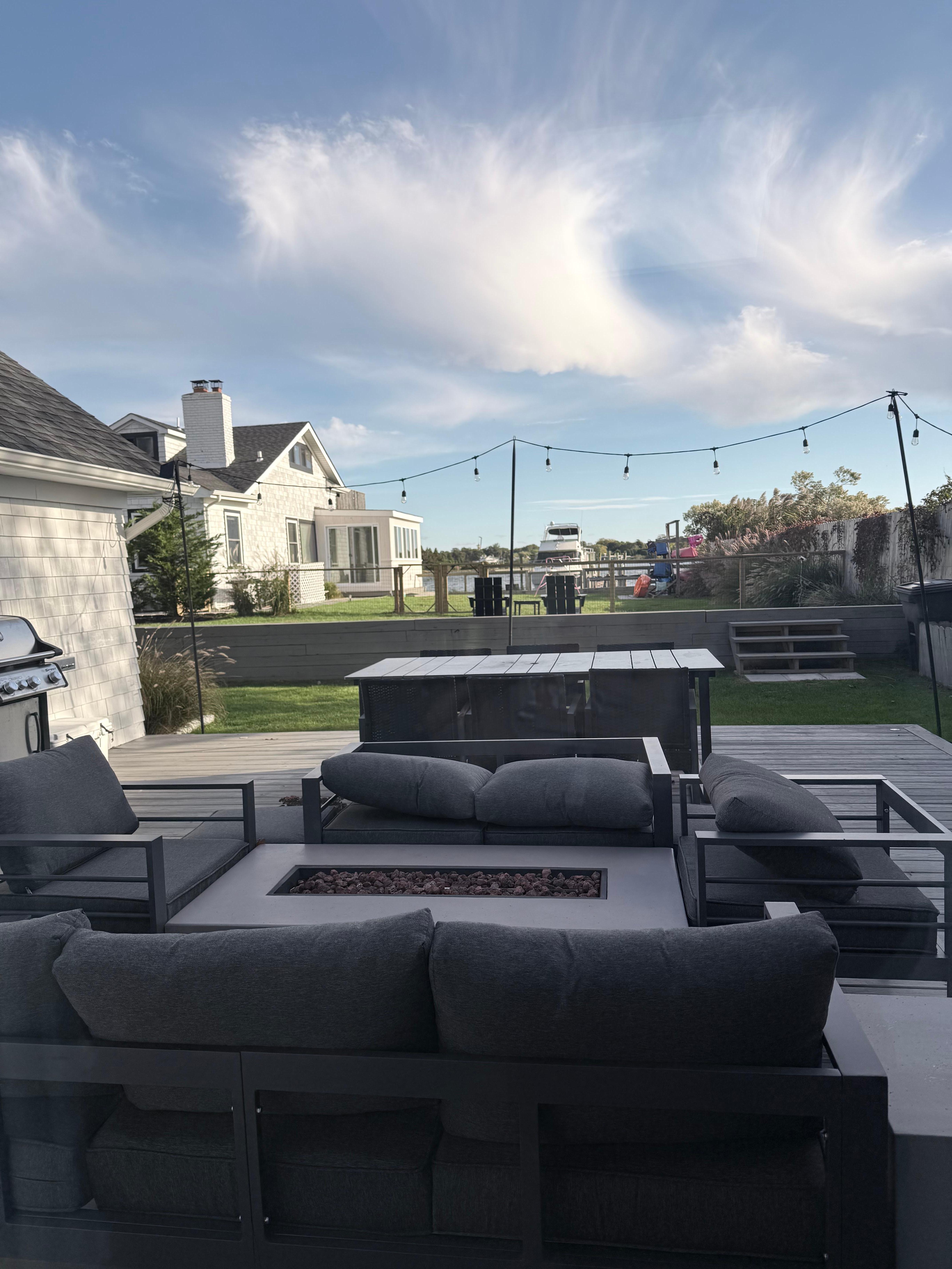 View from the deck of the guest house. A privacy fence of trees was being planted along the fenceline the day we left, which would completely block the water view