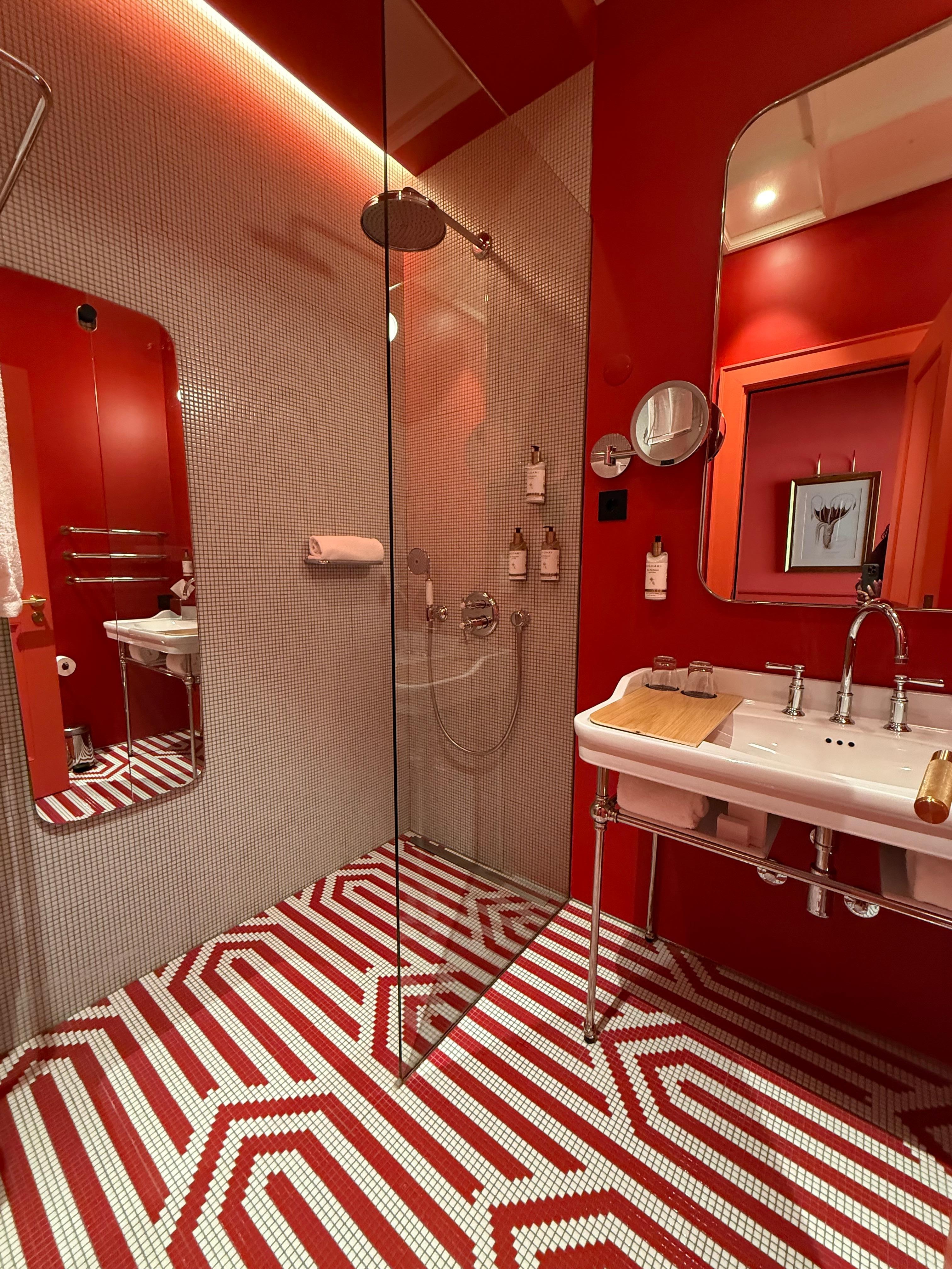 Bright ornate bathroom. Door hit the toilet.