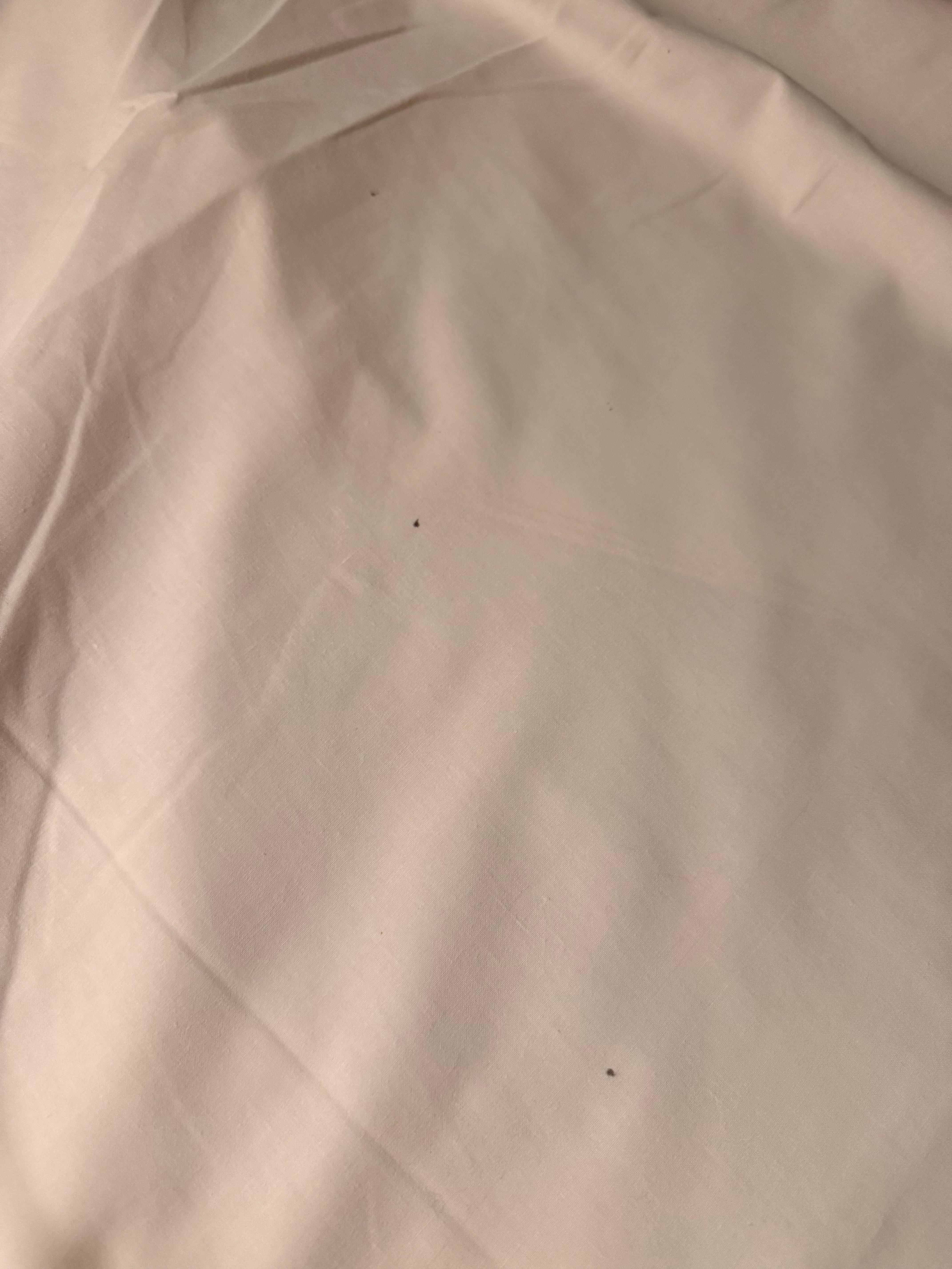 Oily marks on sheets  - signs of bed bug excretion which led to a sub-par nights sleep. 
