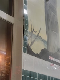 Tile and walls look like they are buckling and falling off every where