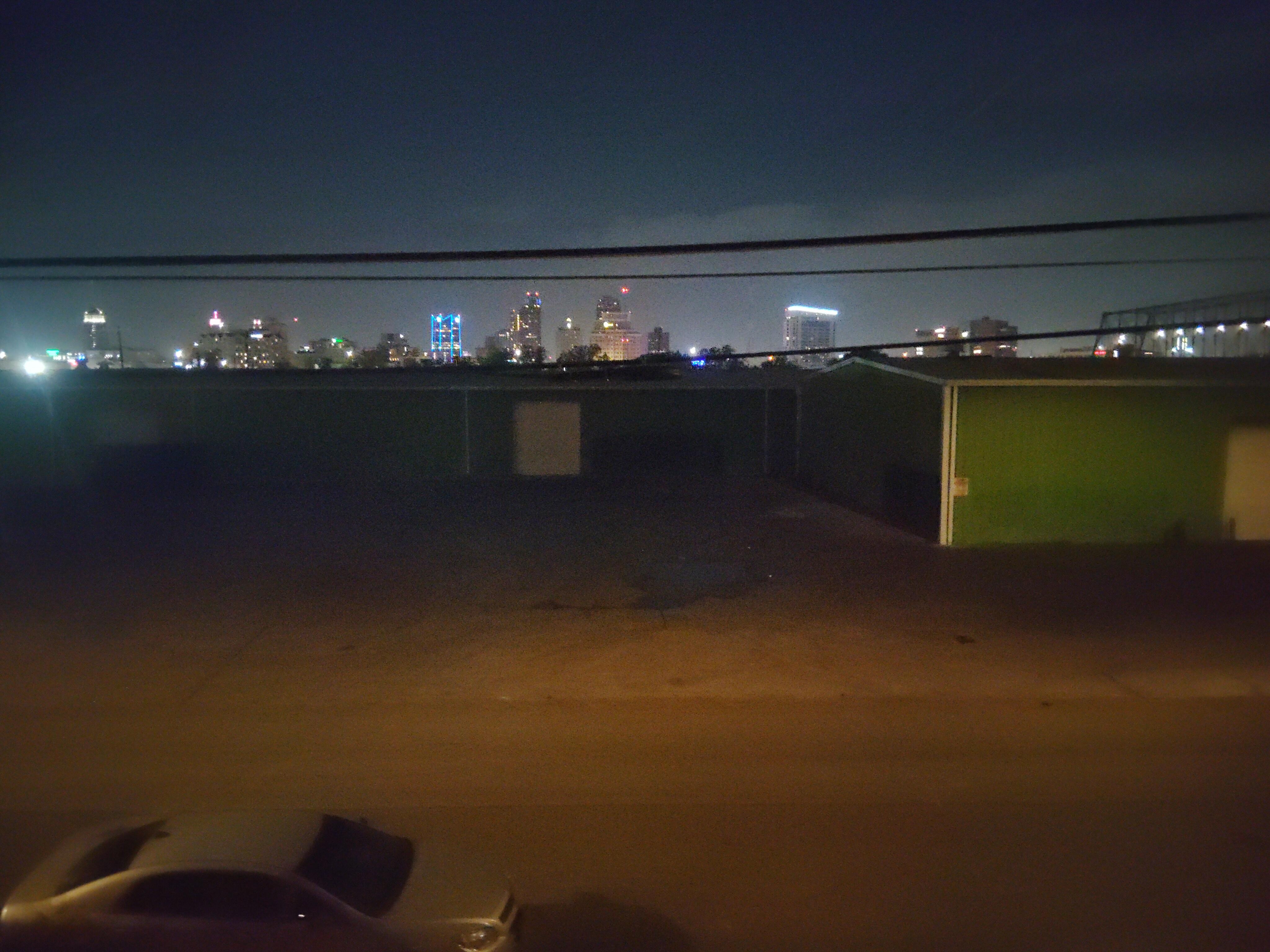 View out of the bedroom window above the bed. 