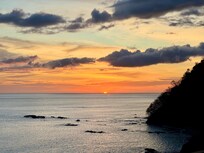 Balcony view of sunset over the pacific.