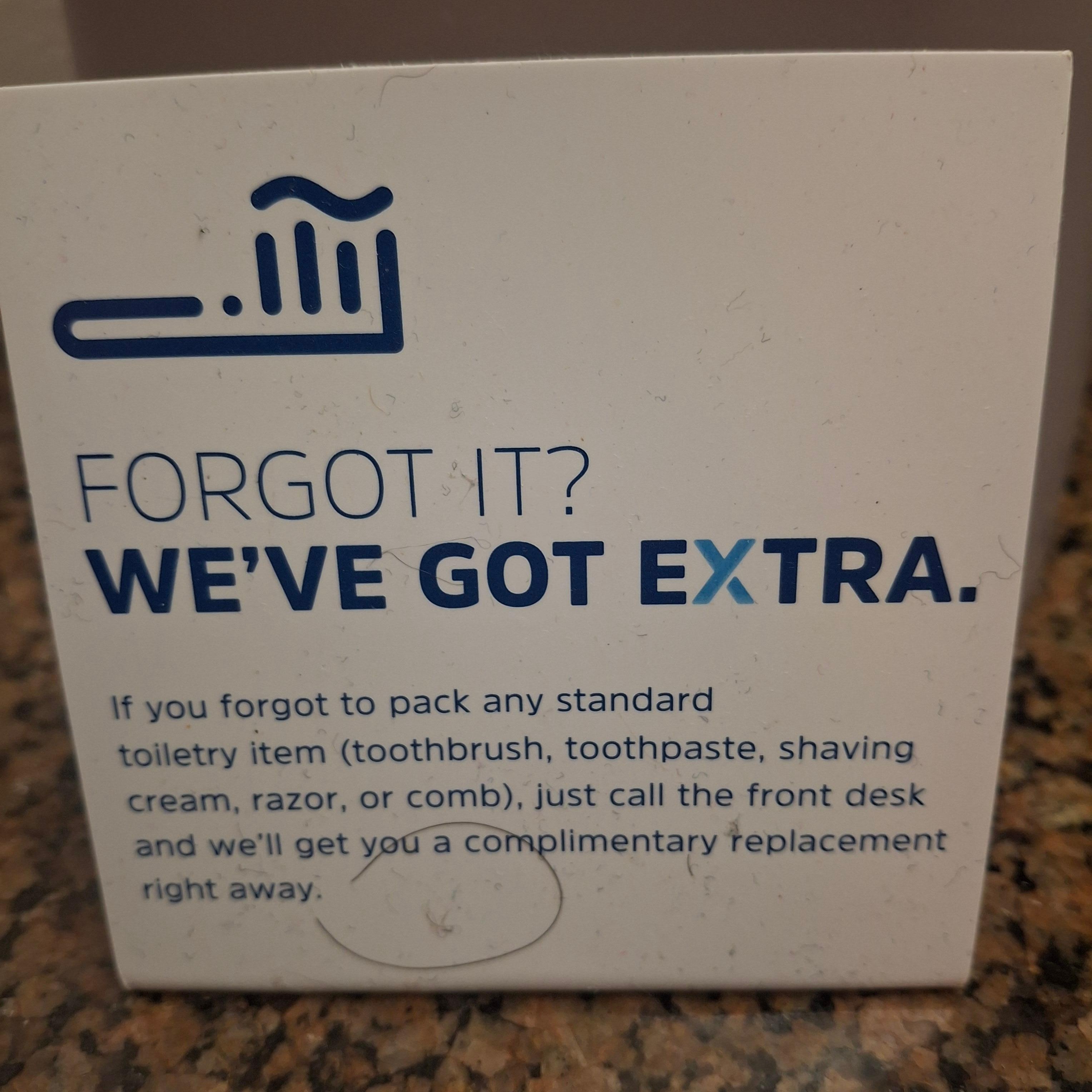 Picture of a sign asking if we forgot anything with an actual hair on it.