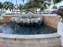 A fountain by one of the pools