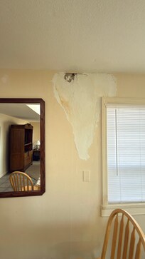 Hole in the wall above the bad patch job . Just a bad experience for the price.