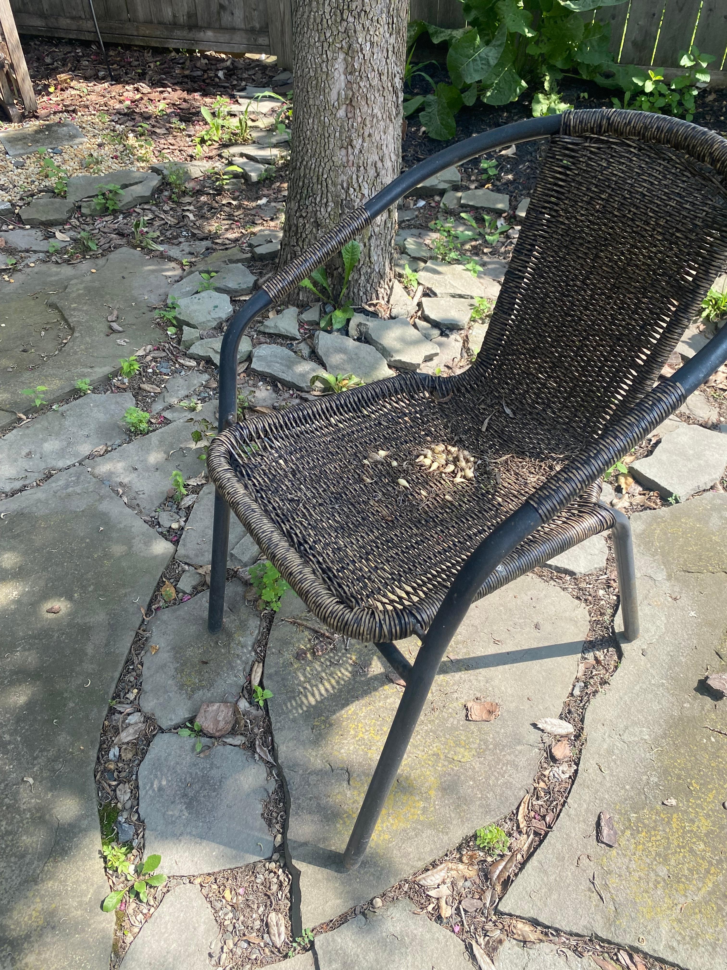 Outdoor busted chair, all the outdoor furniture dirty, filthy rusty unusable 