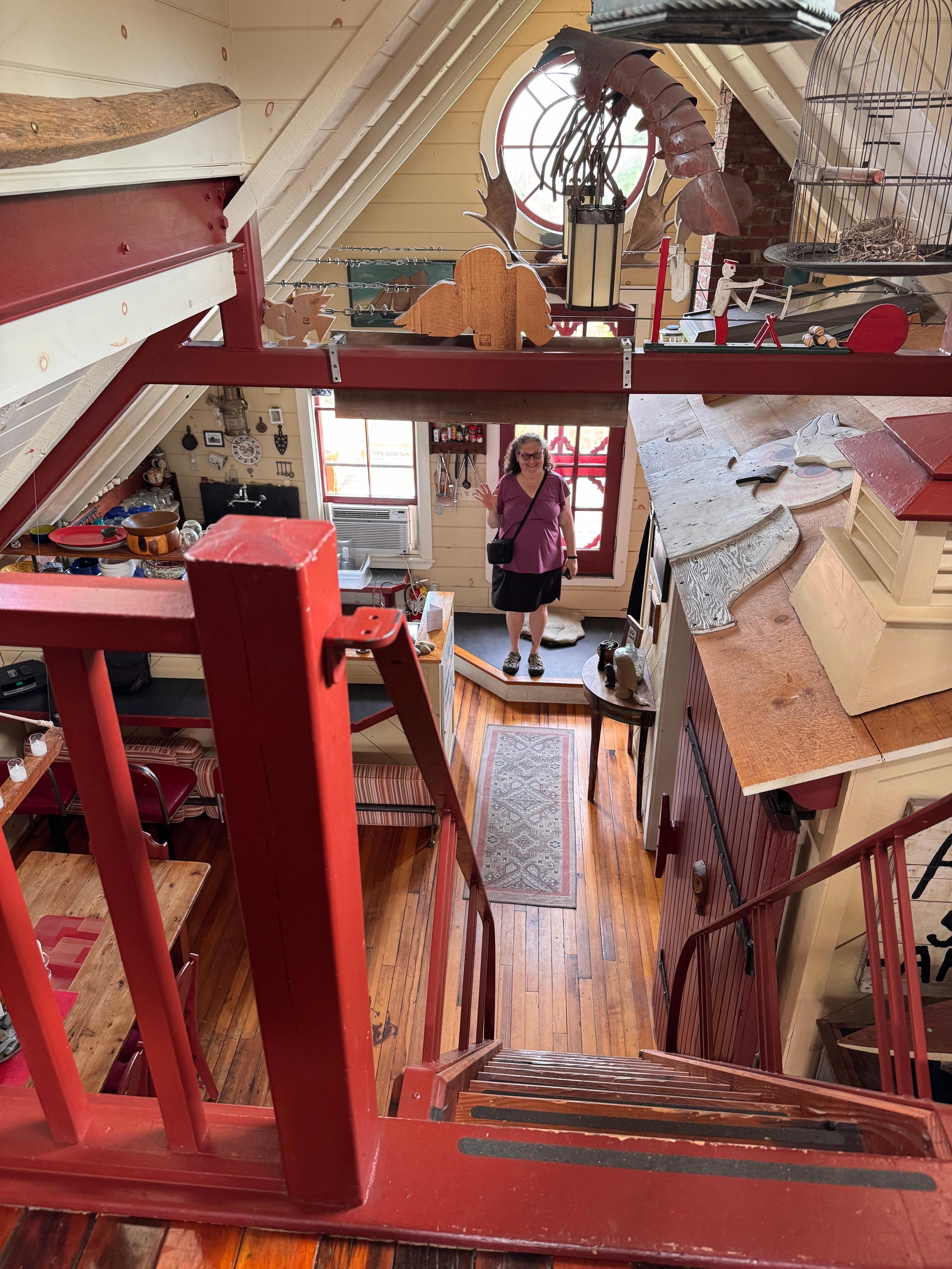 The view from the ½ third floor with queen bed looking toward kitchen – ladder/stairs are a bit steep and the "roof" you see on the right is the top of the bathroom (it makes sense when you see it)
