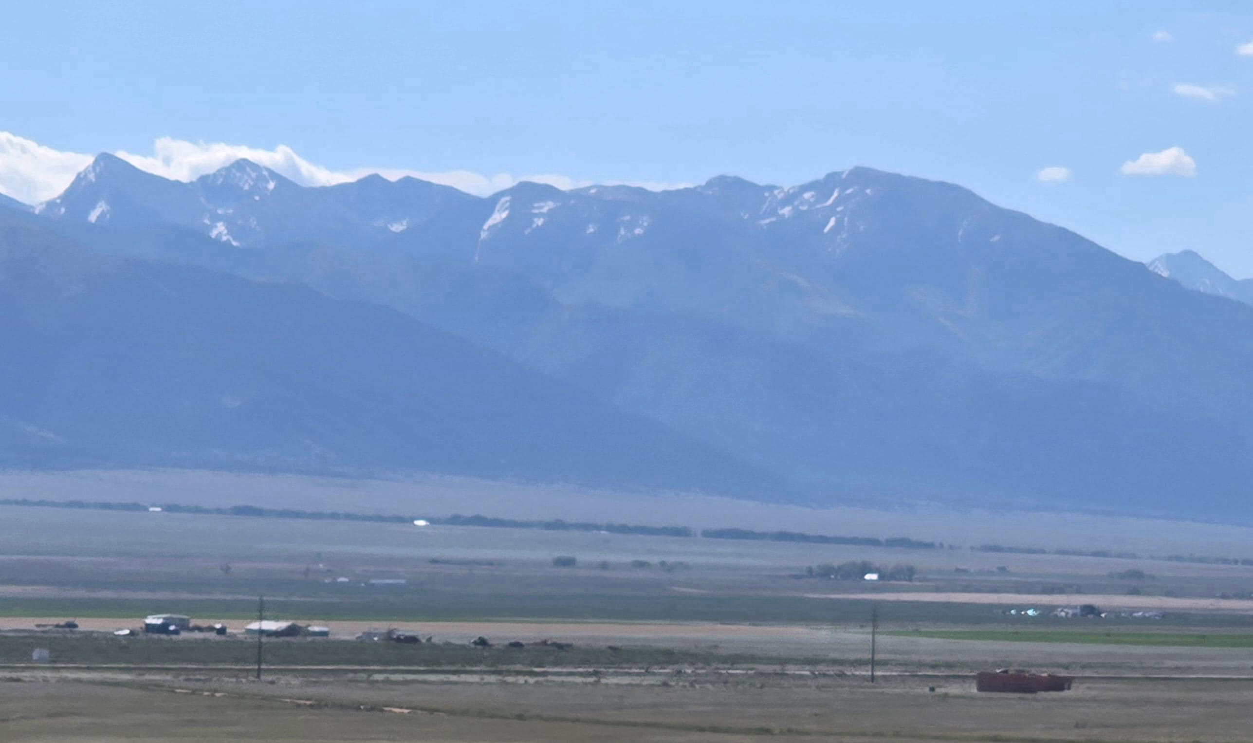 The house on the right and Joyful Journey on the left with the amazing view of gorgeous mountains.