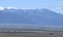 The house on the right and Joyful Journey on the left with the amazing view of gorgeous mountains.