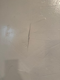 Scrapes and holes in the walls
