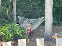 Lounging out by the pool in the hammock.