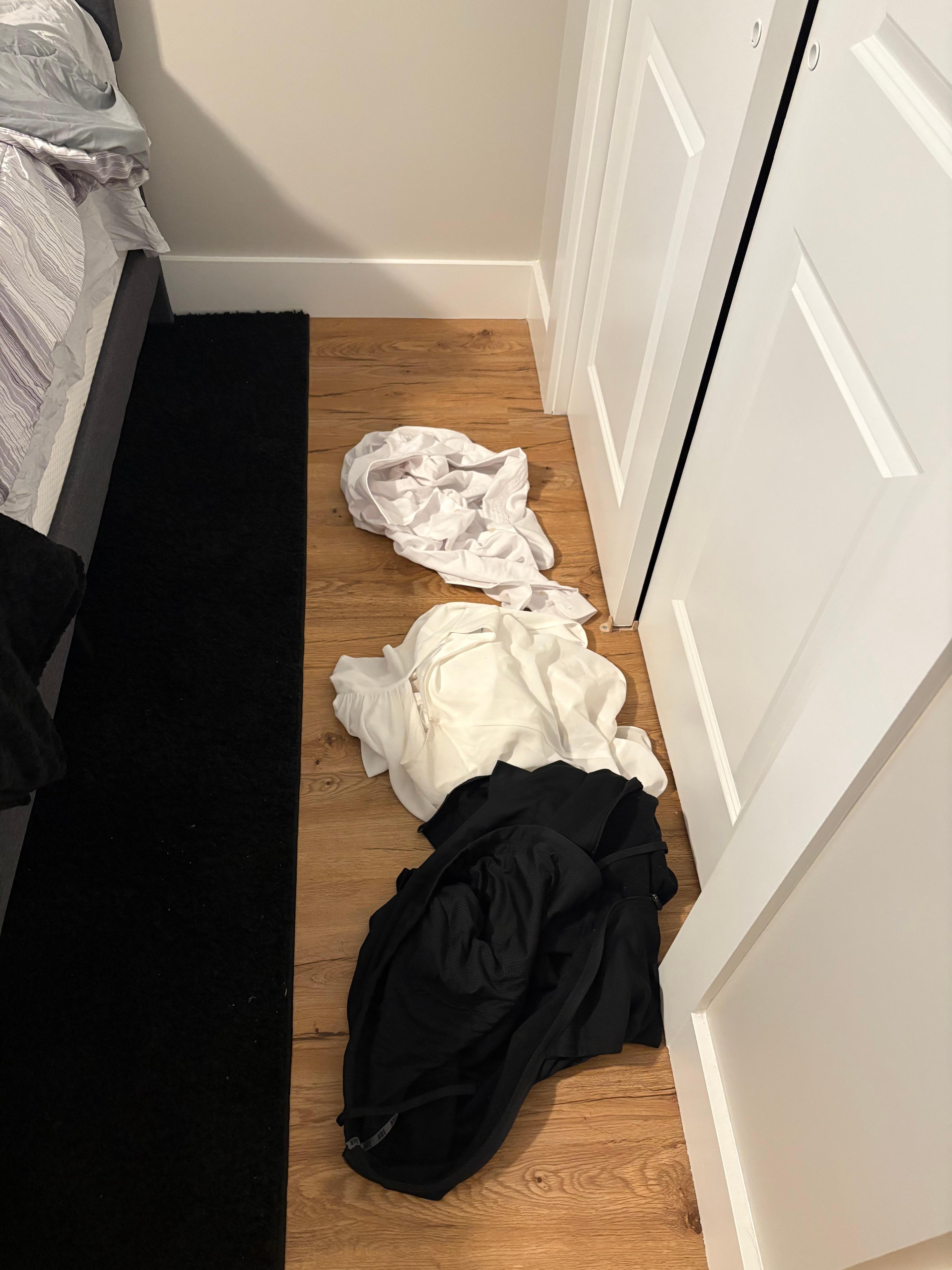 Someone’s clothes beside the bed 