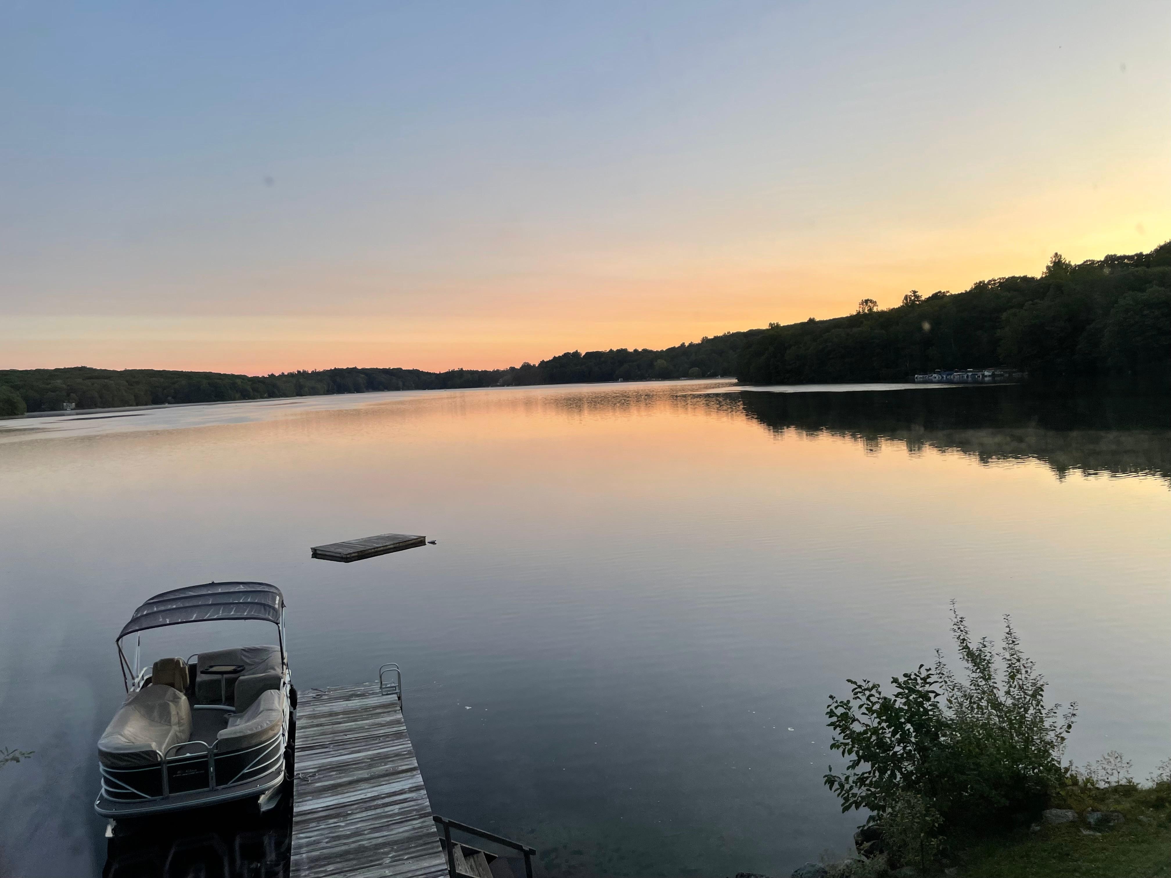 Placid lake at sunrise. 