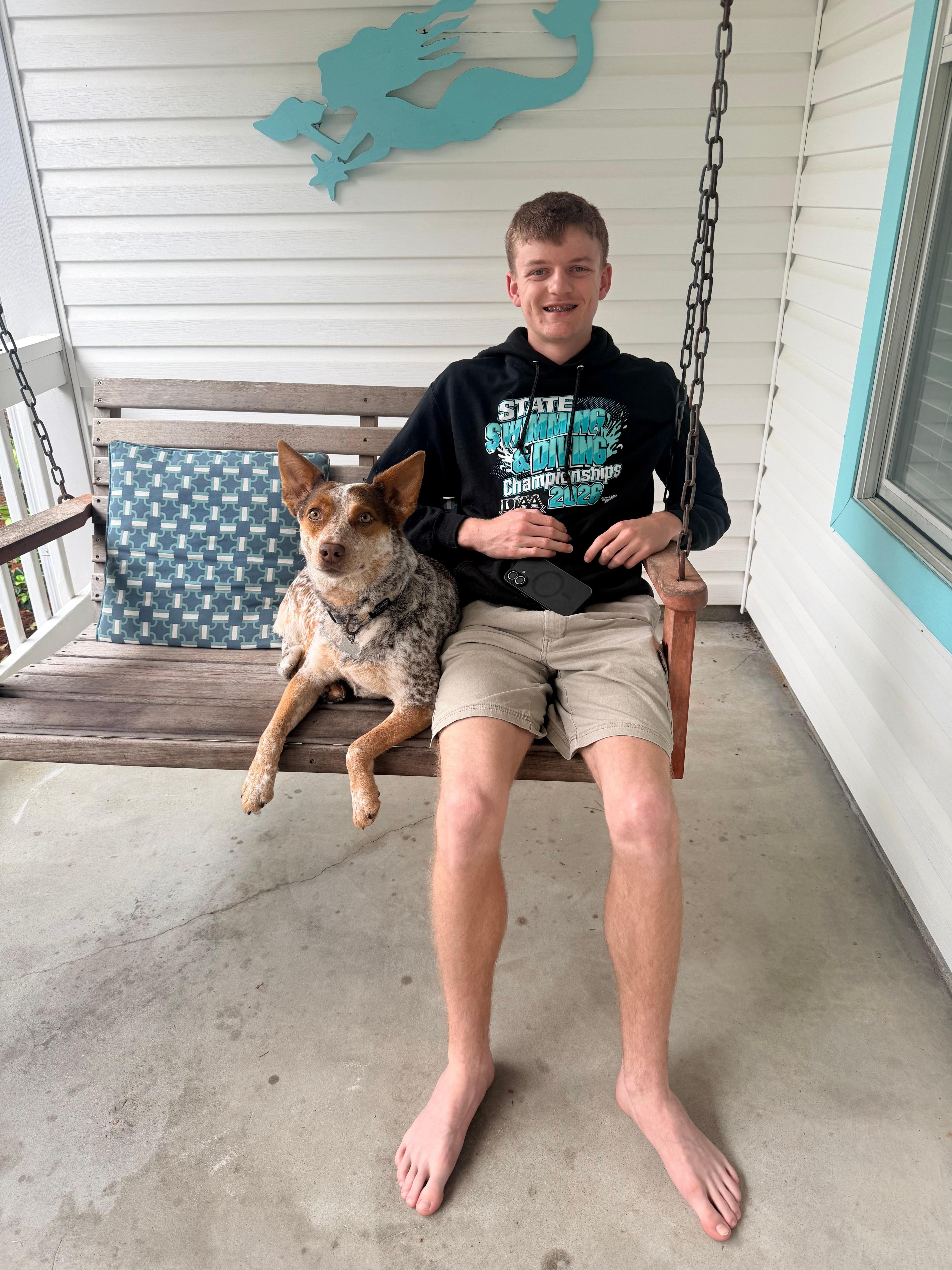 Our son with Tilly enjoying the porch swing. 