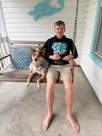 Our son with Tilly enjoying the porch swing.