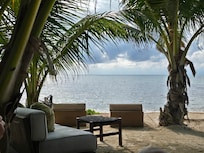 Beach view from sofas.