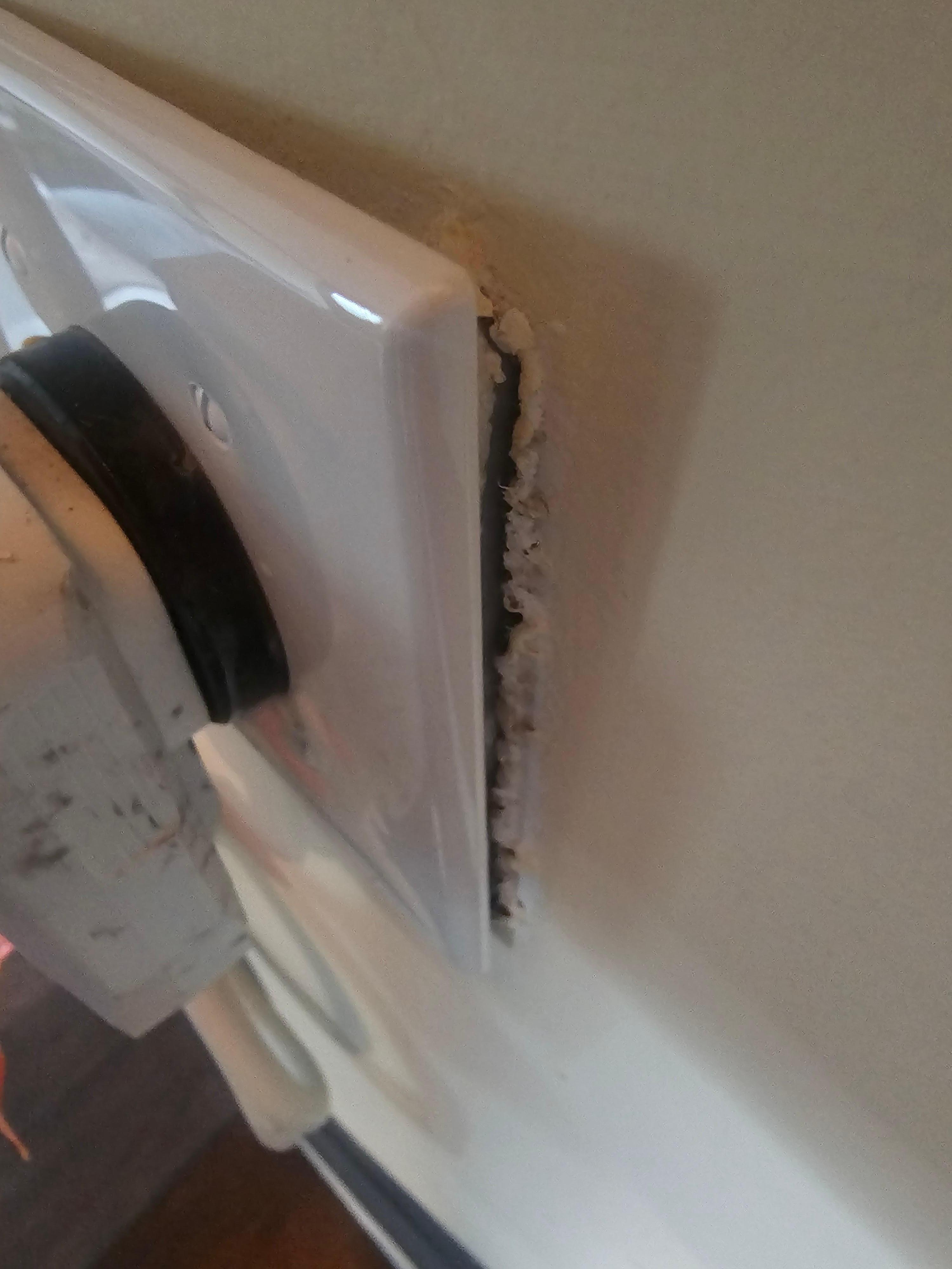 AC outlet in the living room going up the stairs coming off the wall