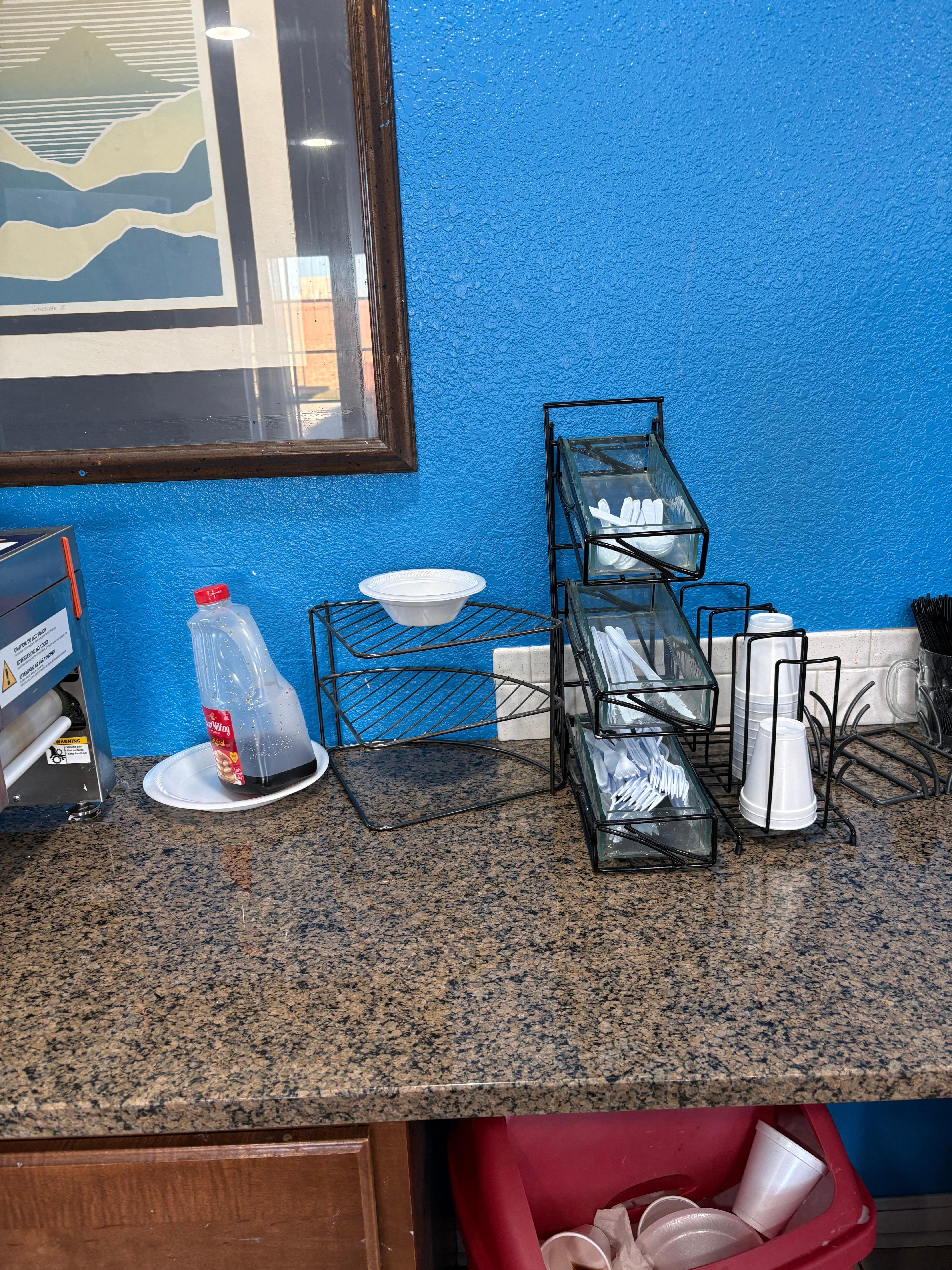 No plates, sparse utensils, no napkins but a roll of paper towels