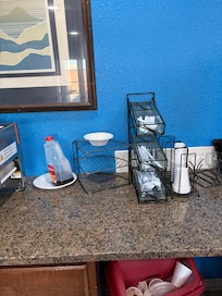 No plates, sparse utensils, no napkins but a roll of paper towels