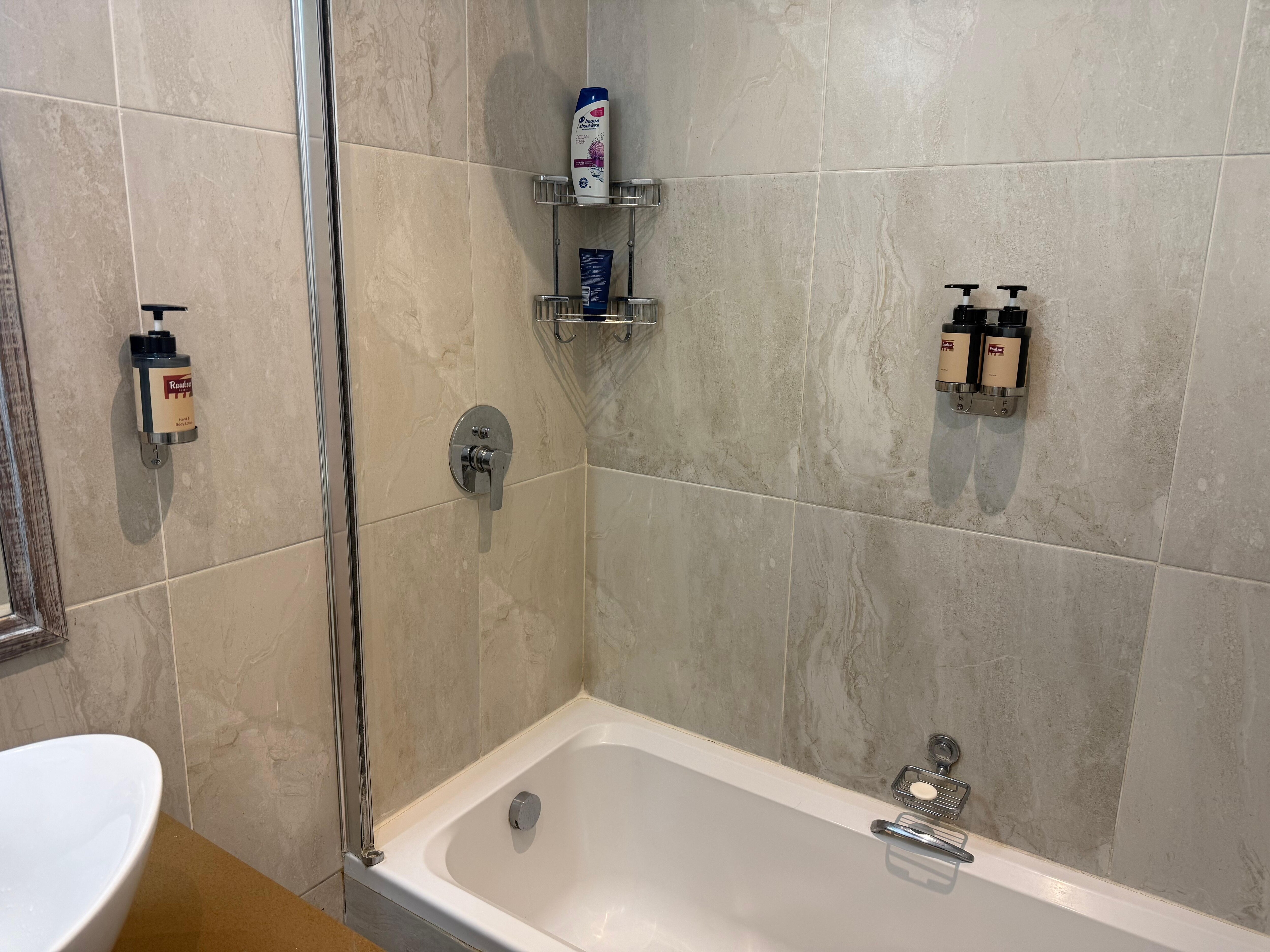 Shower with no door or curtain.