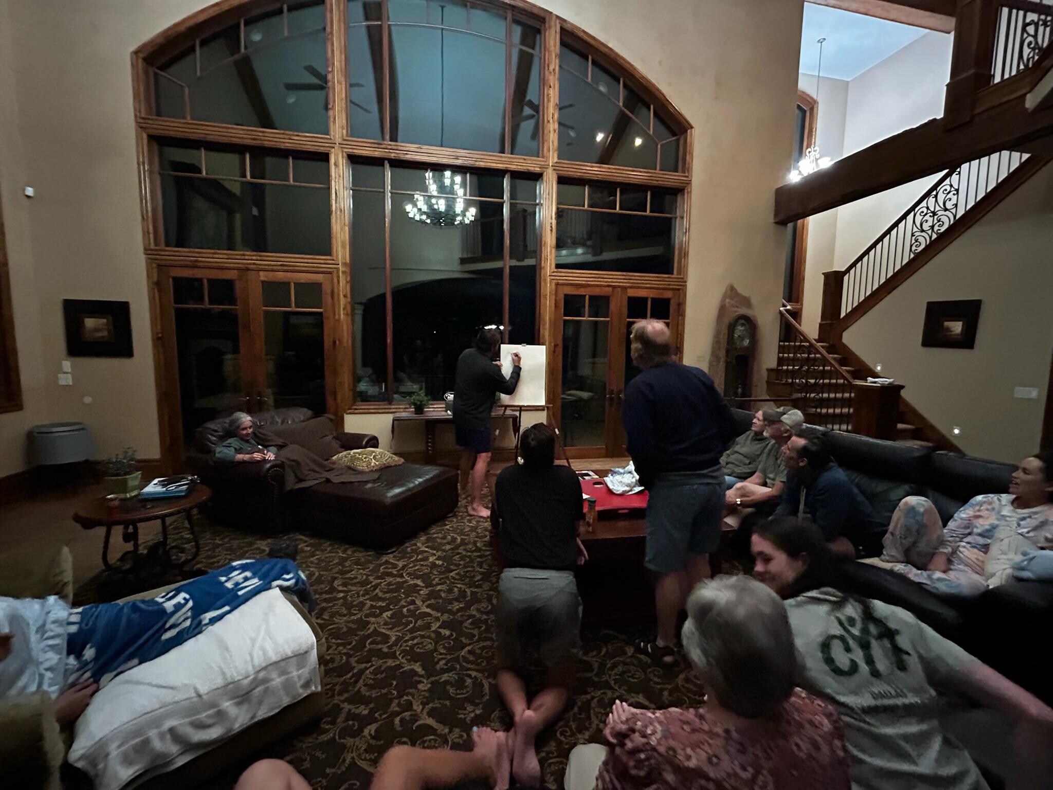 Playing Pictionary in the large gathering space. 