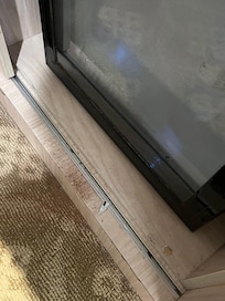 Trash at the mini fridge.