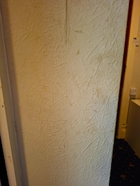 dirty walls and split wallpaper