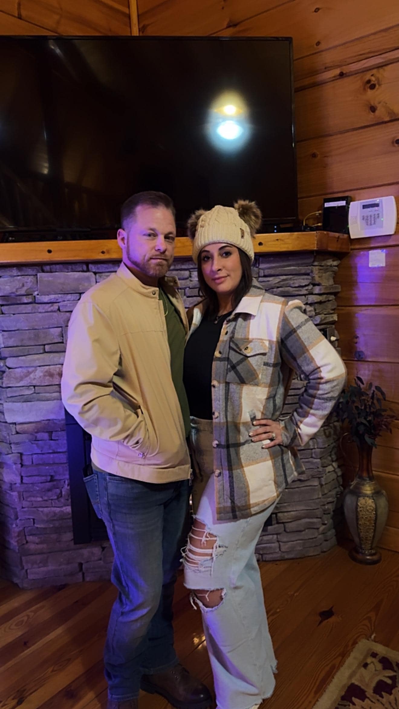 Me and wife by the Christmas tree in the cabin