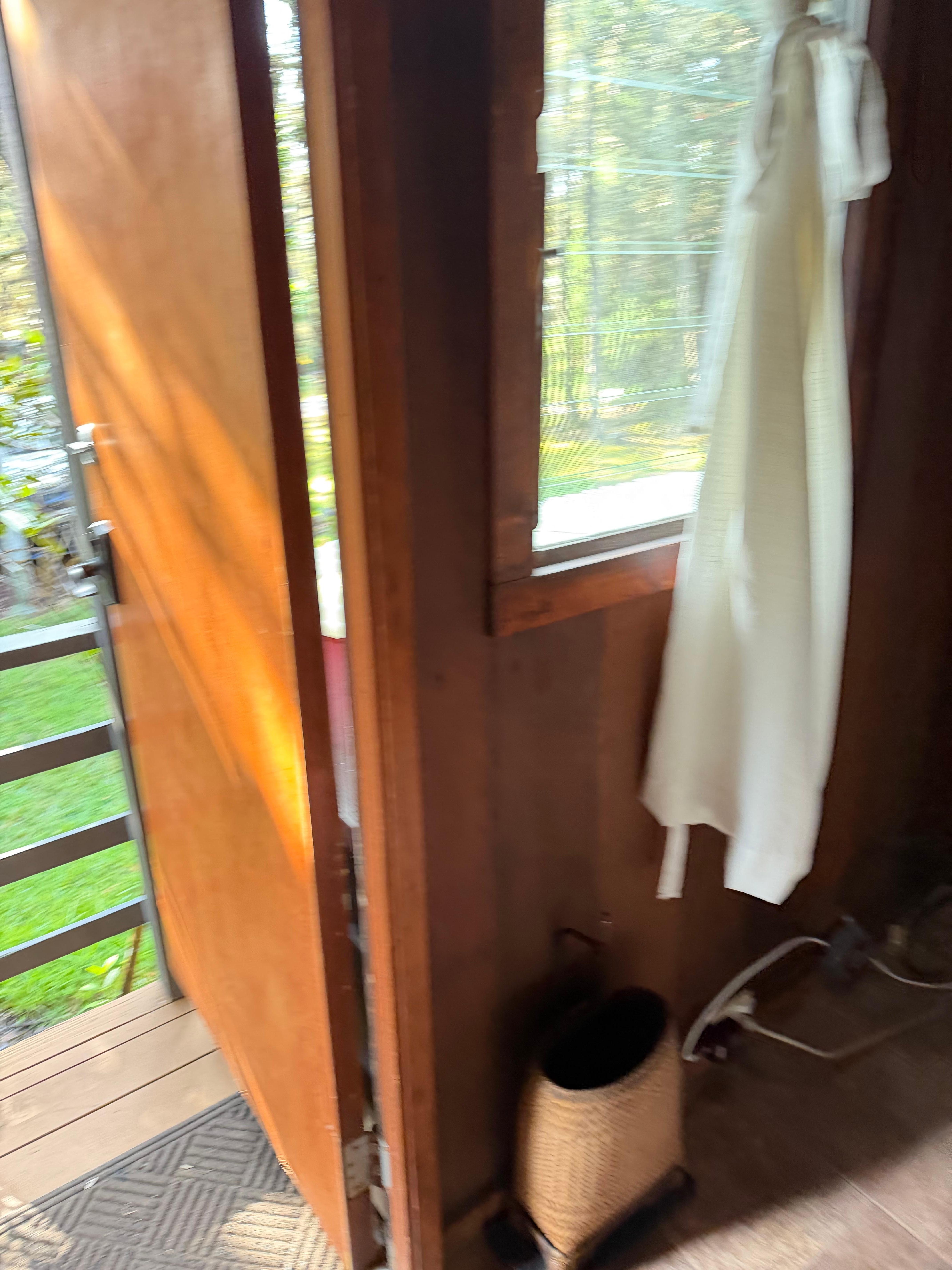 Front door to entry way “bedroom” with futon