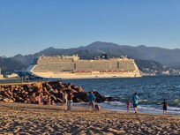 The beach where you can see cruiseships depart and arrive.