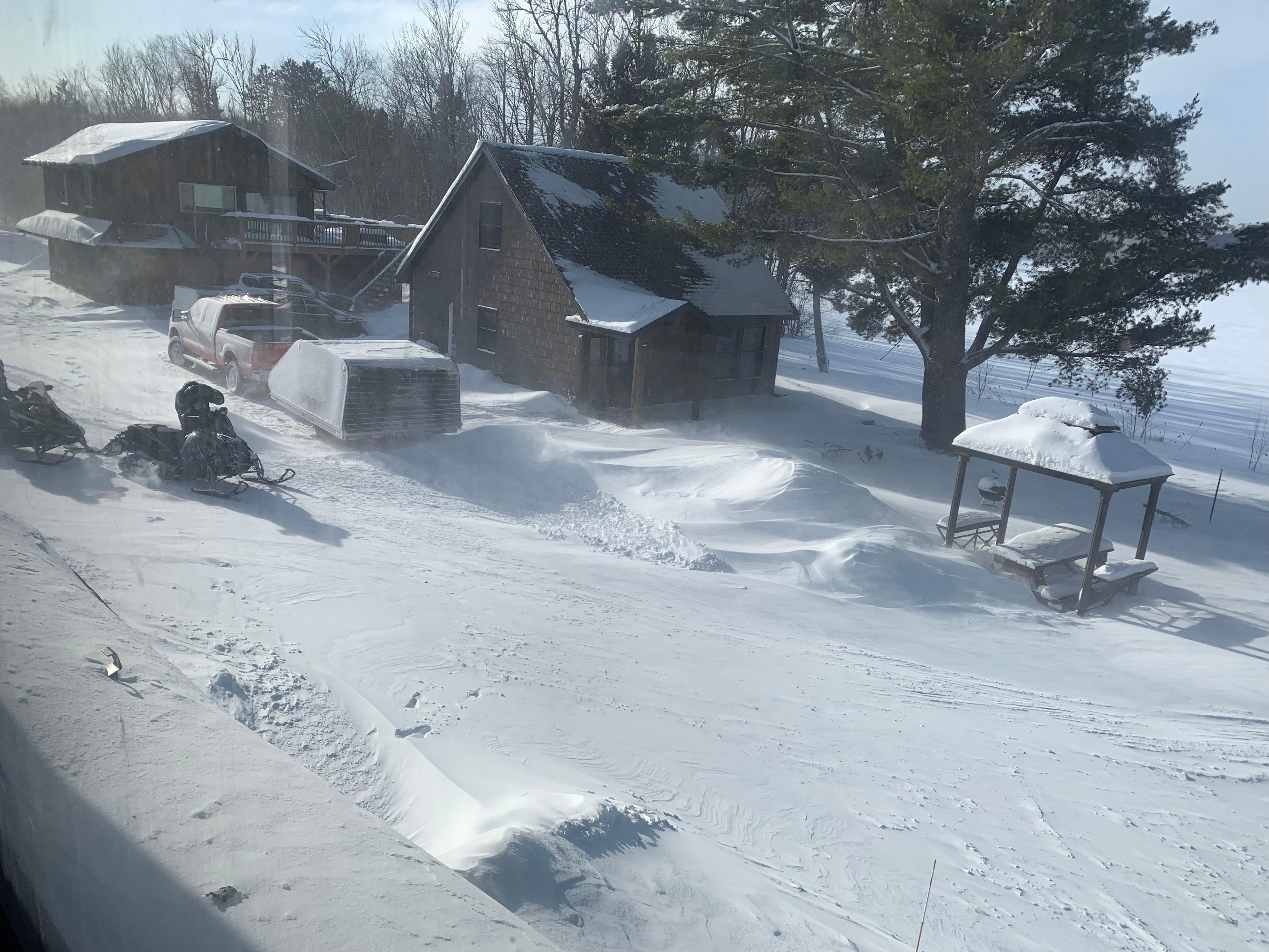 View from living room with snow drifting in