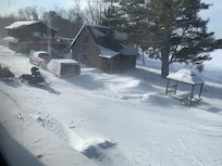 View from living room with snow drifting in