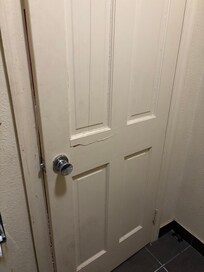 This is the bathroom door that was closed. Look like somebody tried to break in at one time before serious make