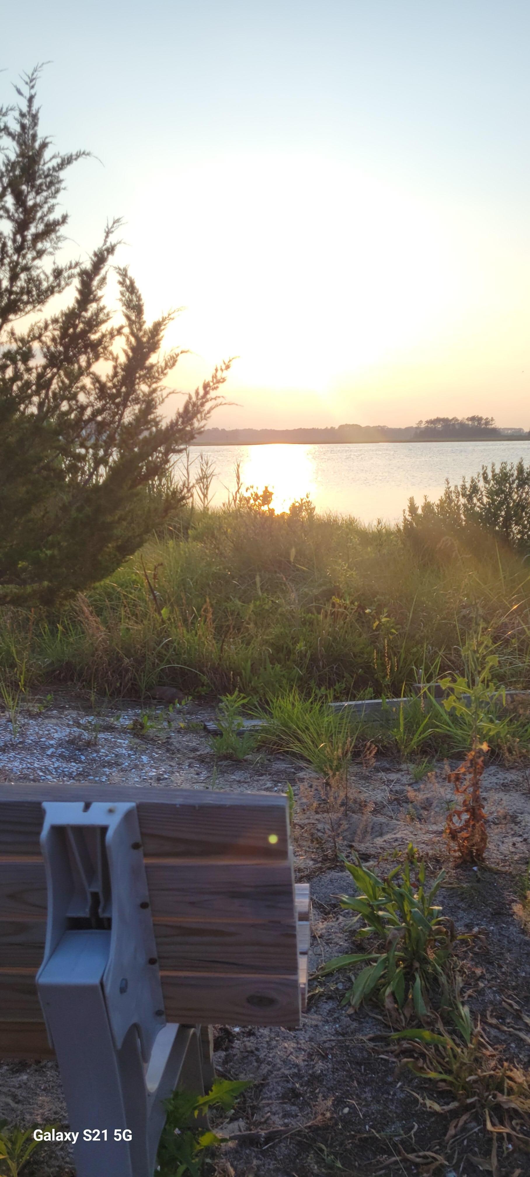A sitting area on the path to the fishing pier and mini beach 