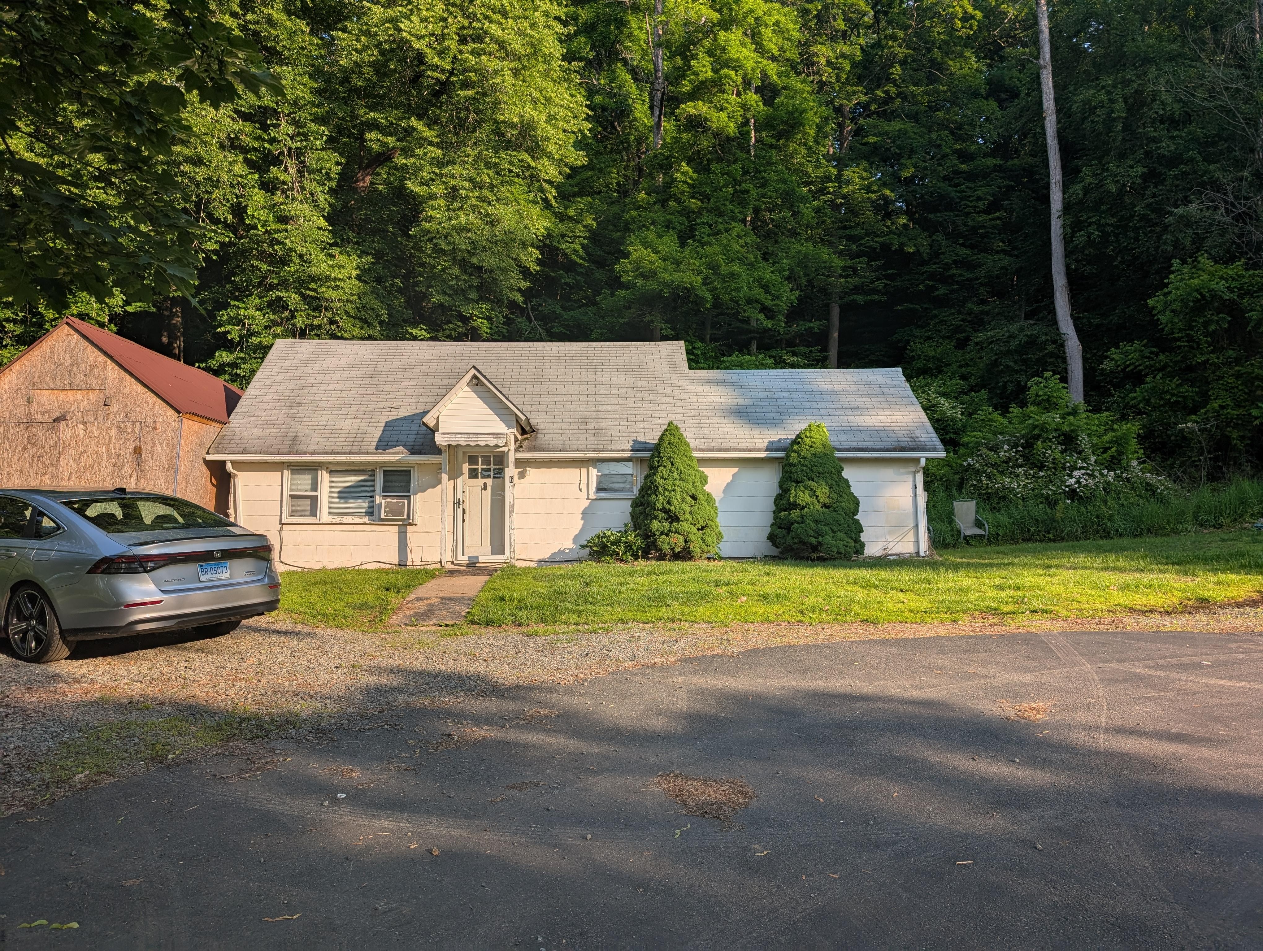 View from the driveway.  There's a neighboring house on the right