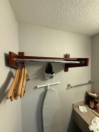 Coat rack falling off the wall.