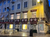 The front side of the street to get to hotel.