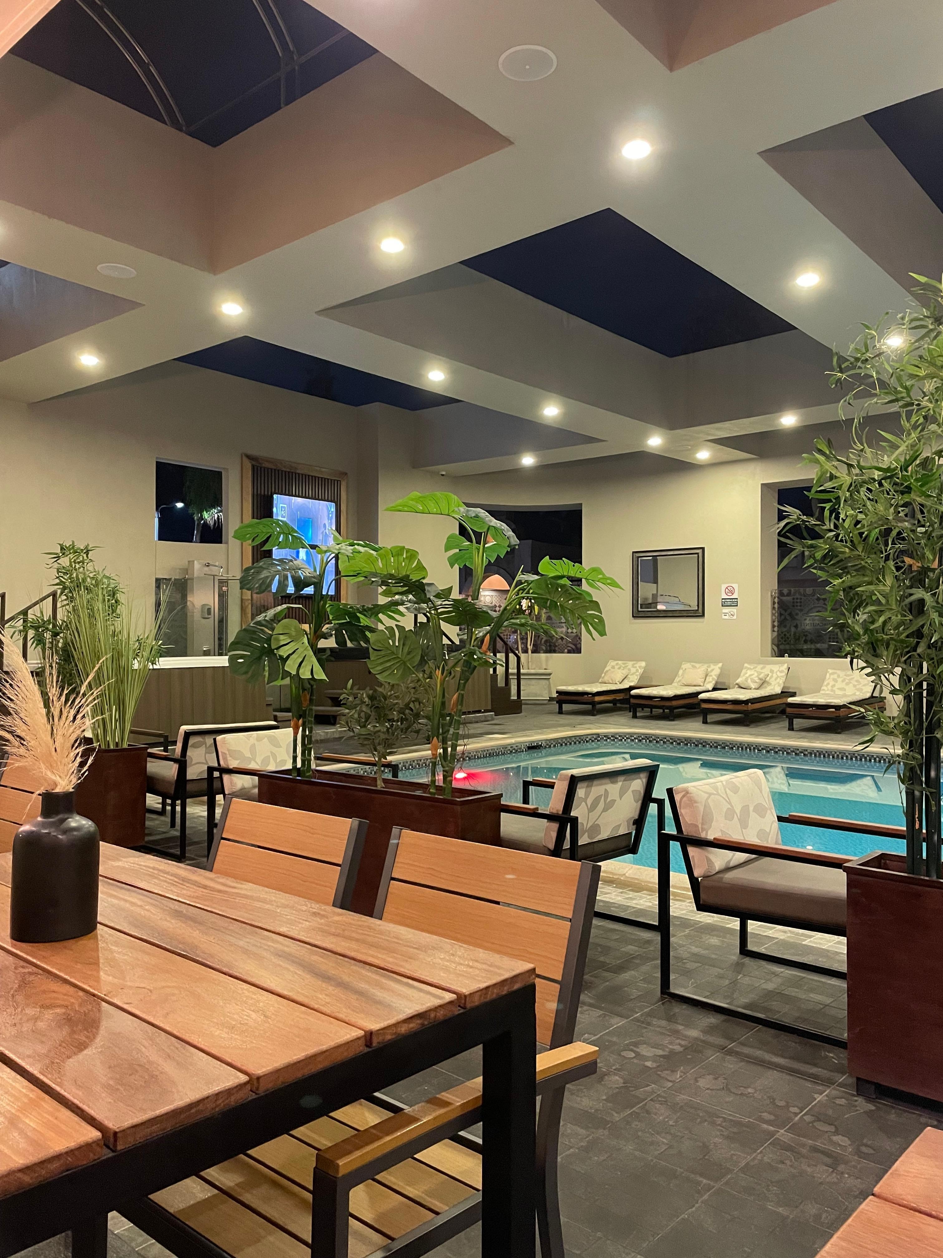 Sitting near the pool/bar working some emails 