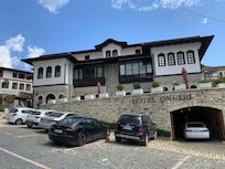 Approach to Hotel showing parking space