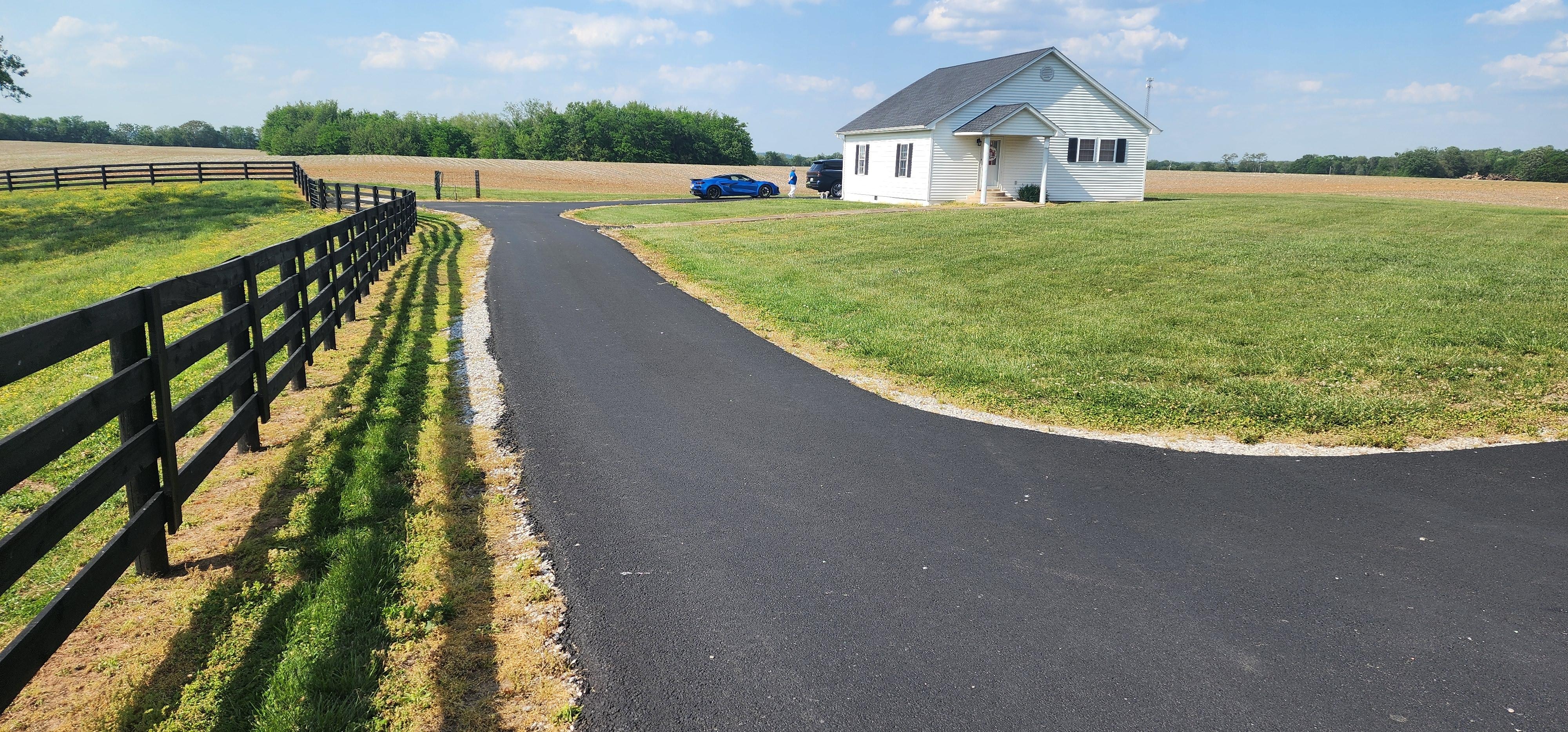 Halfway down the long driveway.