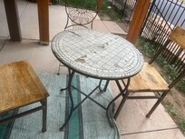 Front porch furniture, dirty and damaged, note table top and chair seat.