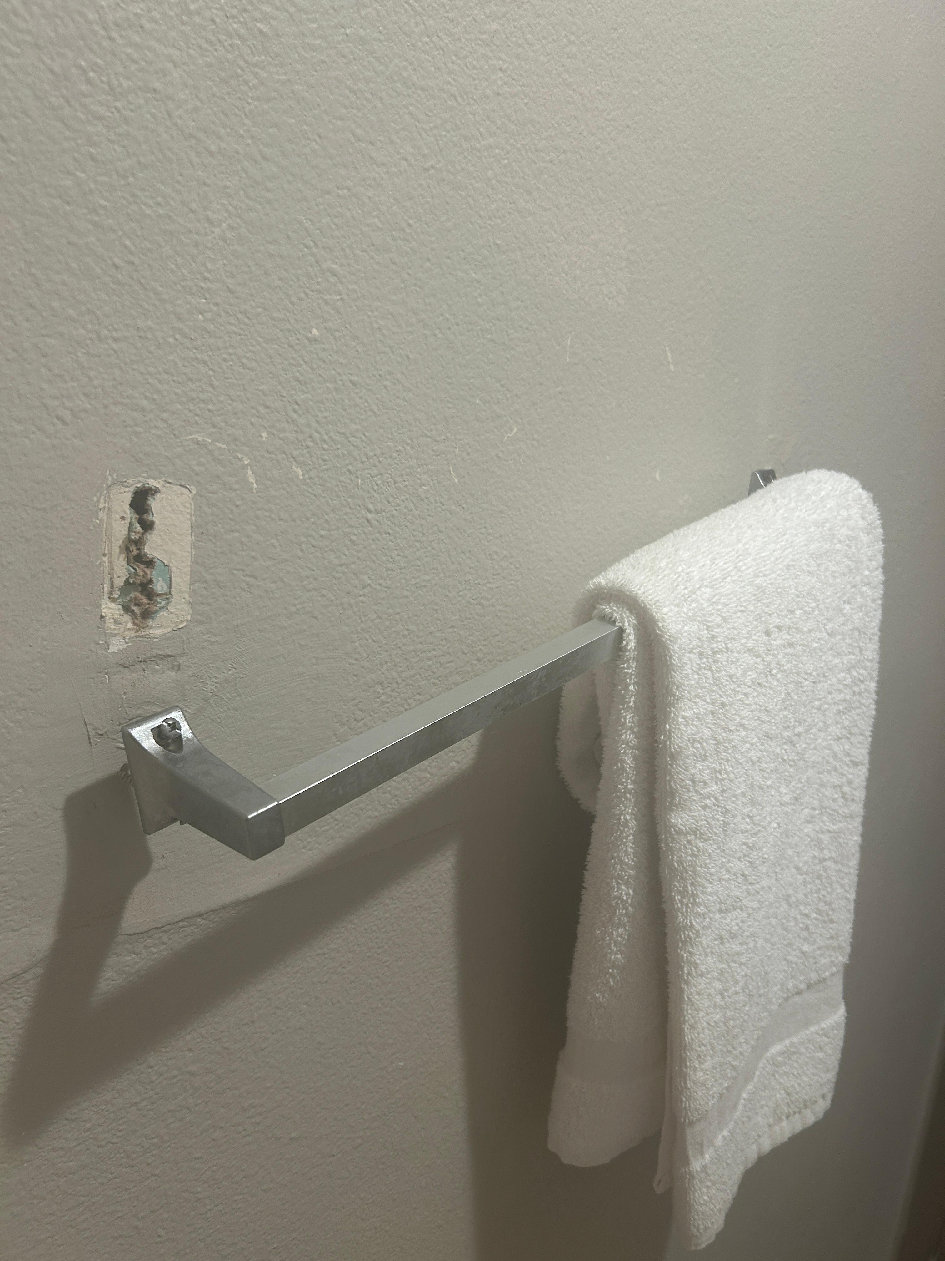towel rack in bathroom, eventually fell all the way out