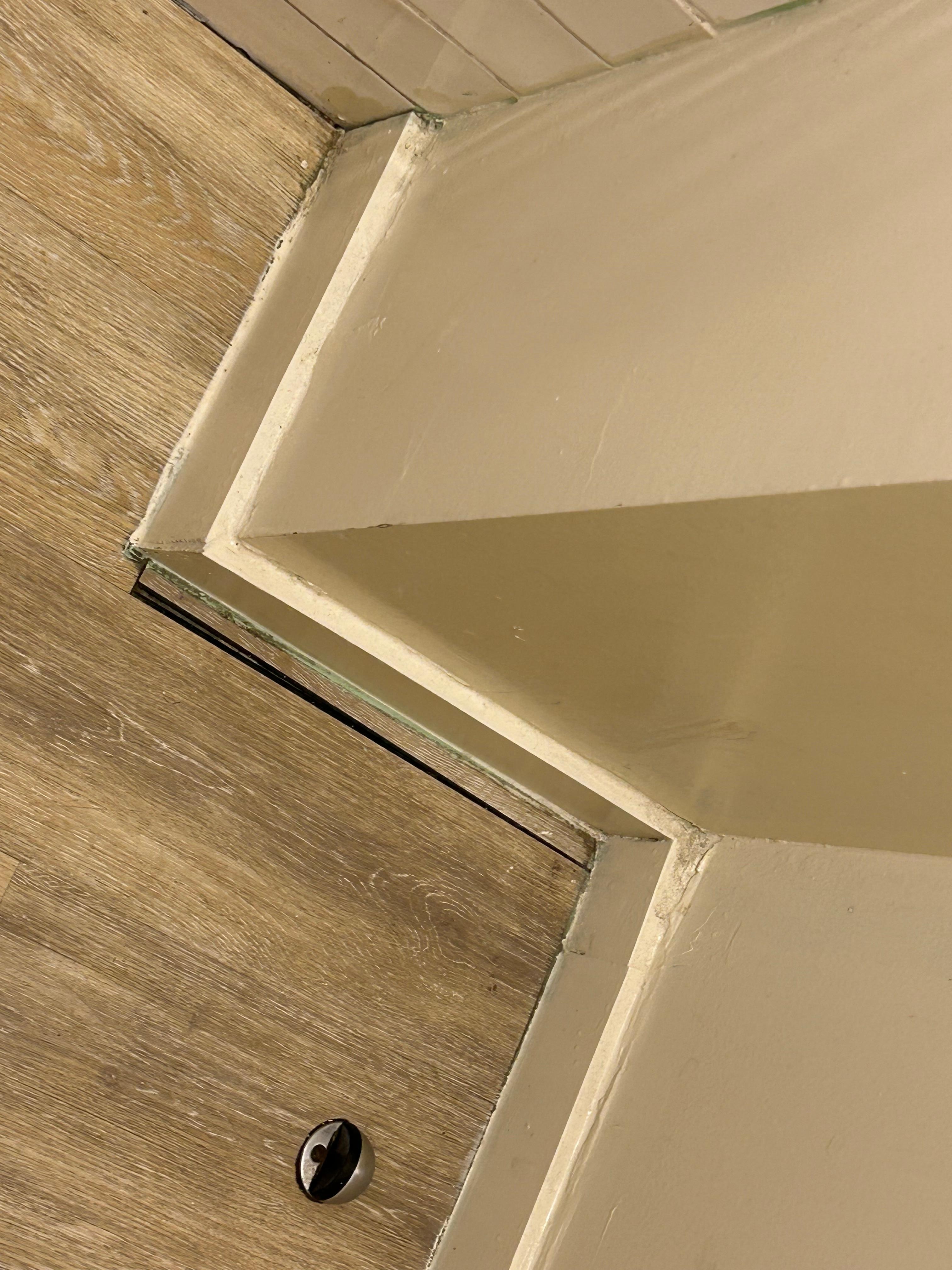 Complete crappy workmanship.  Pices of floor missing.  VERY dirty floor and baseboard 