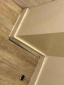 Complete crappy workmanship.  Pices of floor missing.  VERY dirty floor and baseboard