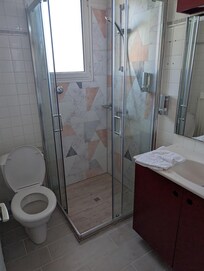 Bathroom tired, modern shower tiling.