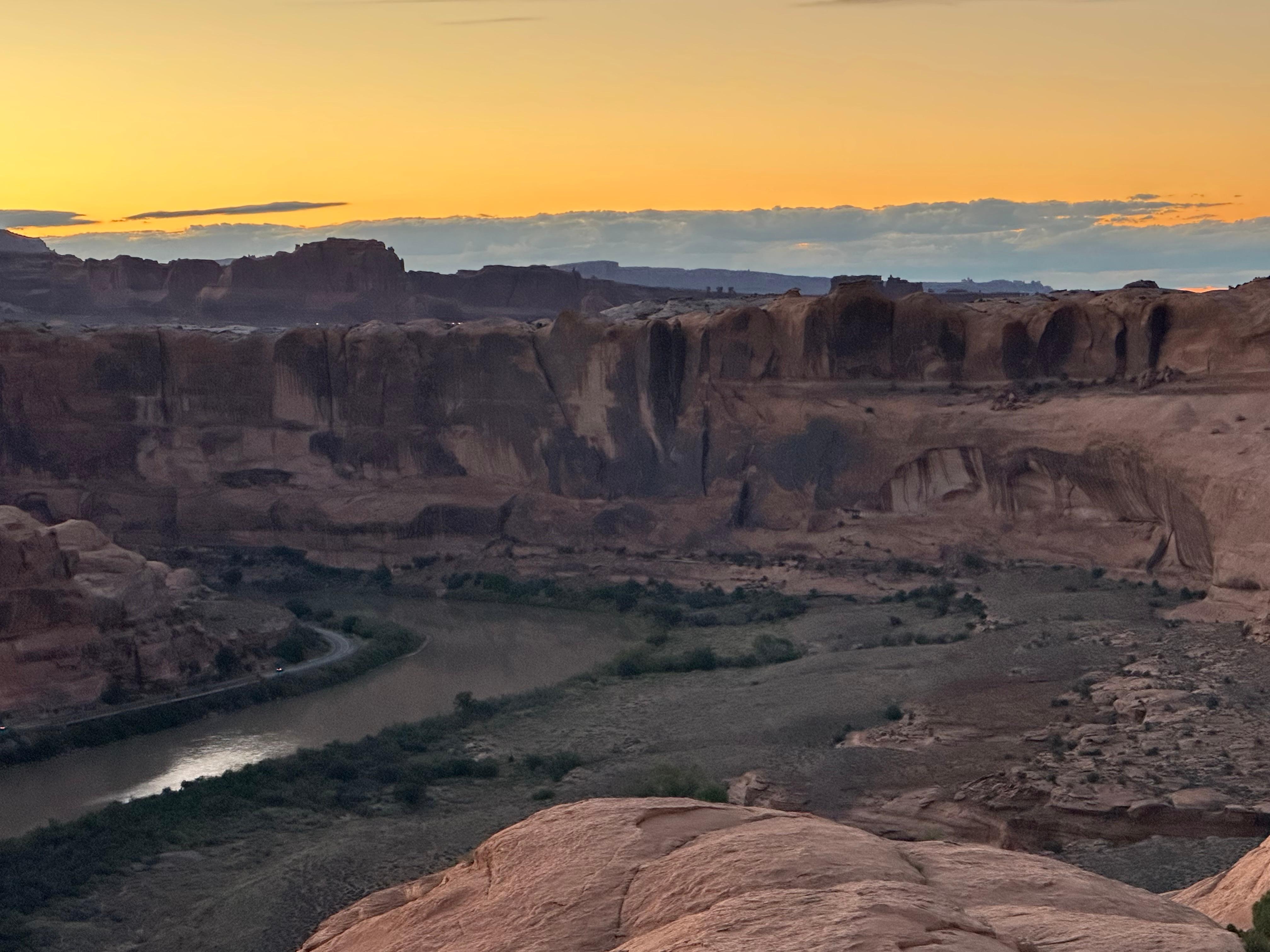 Sun setting above the canyon where the Colorado River runs through it. 