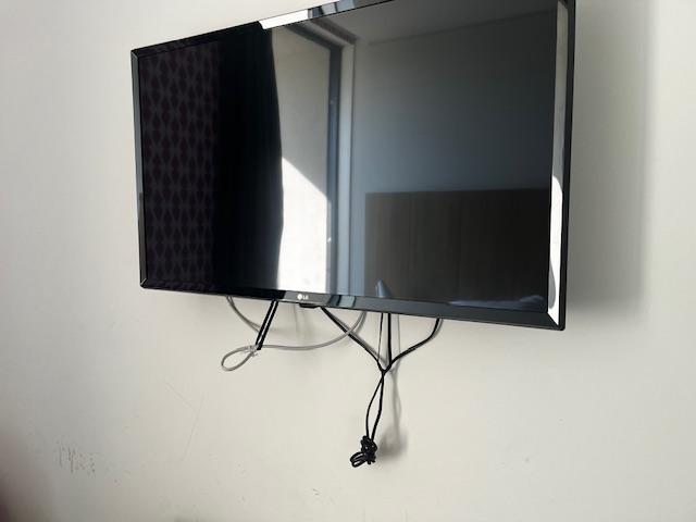Cords hanging from TV