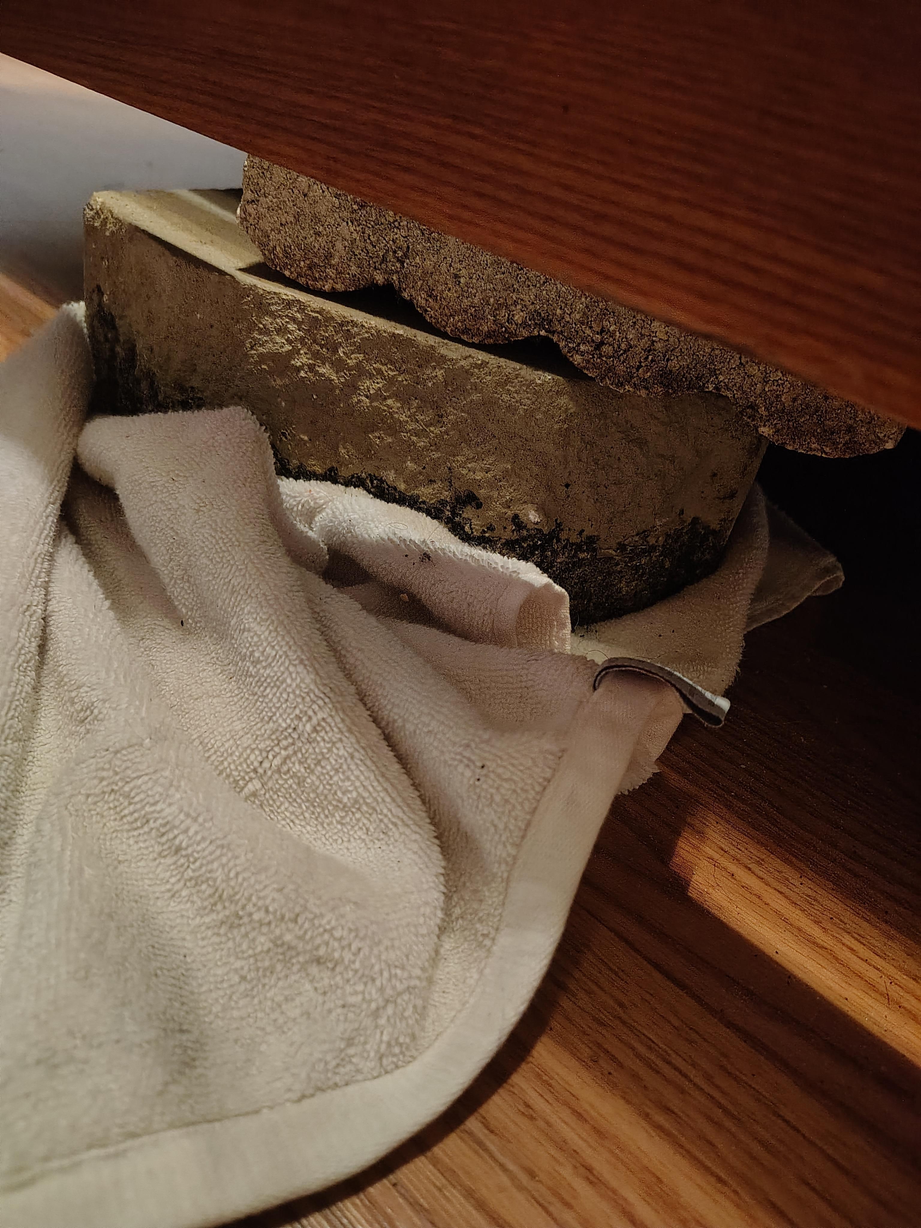 King size bed in Master bedroom is being held of by a concrete block 