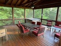 The screened in porch & hot tub